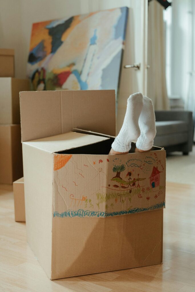 Brown Cardboard Box on Brown Wooden Table